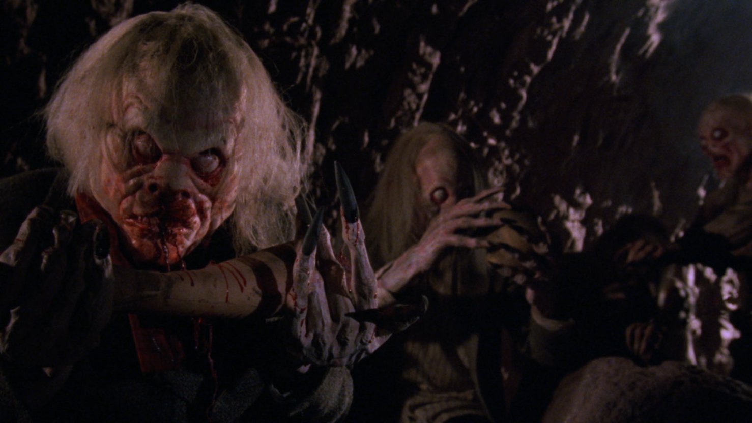 The creatures lurking beneath the graveyard in Lurking Fear (1994)