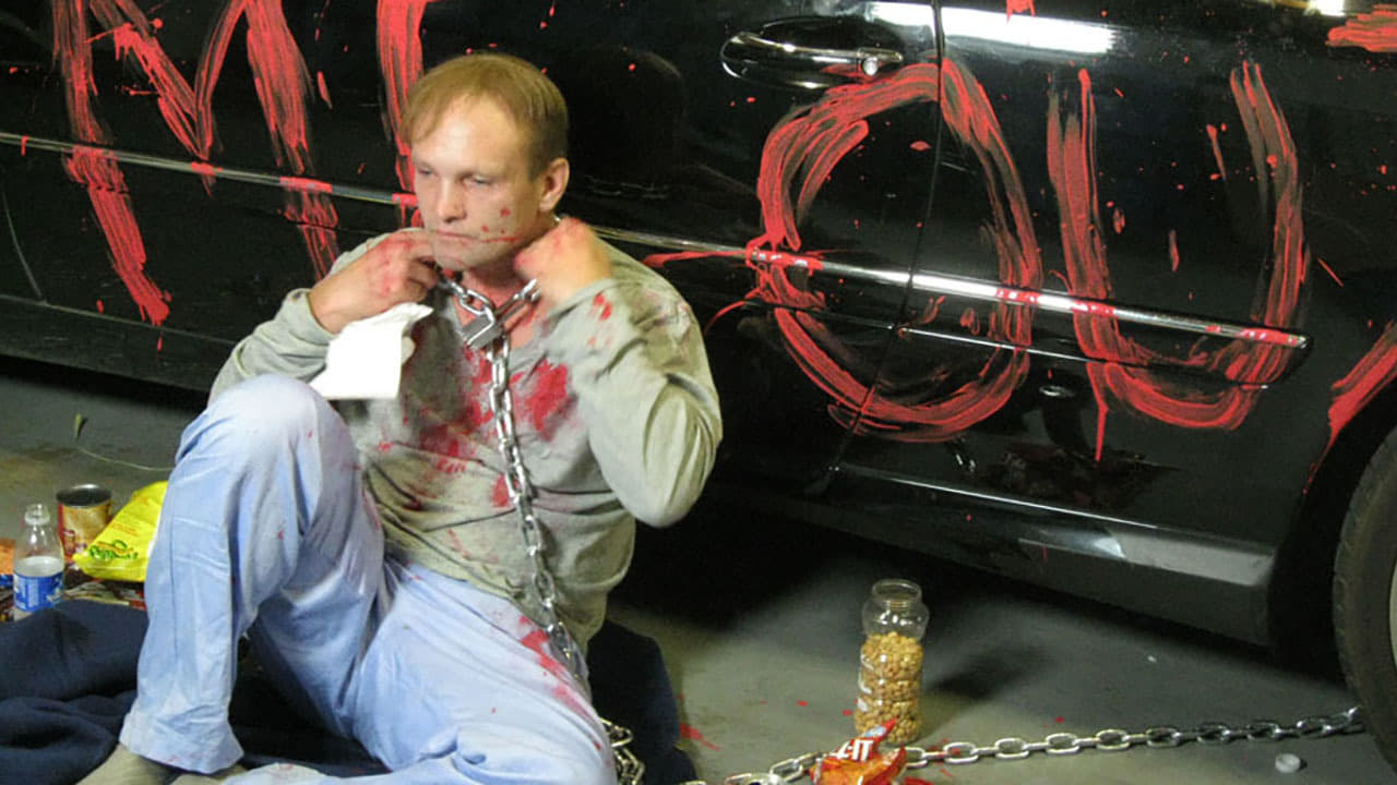 Andrew Howard chained up in Luster (2010)