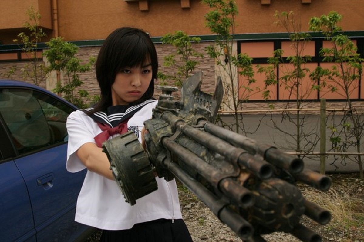 Minase Yashiro with machine gun arm attachment in The Machine Girl (2008)