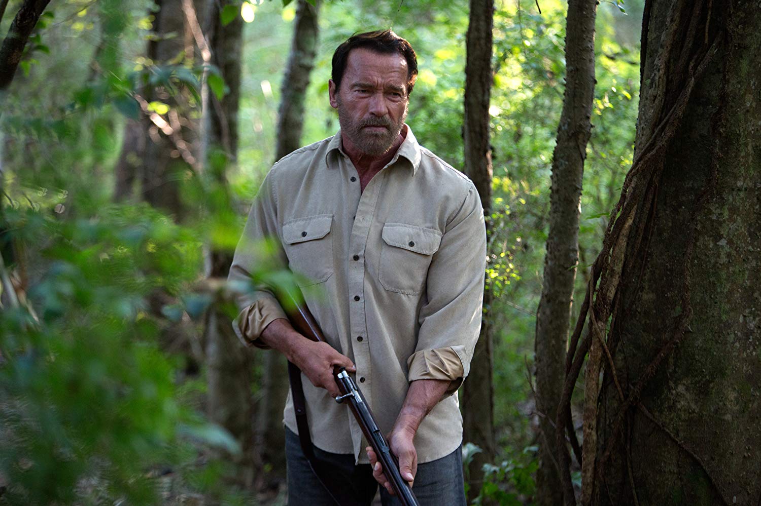 Arnold Schwarzenegger wielding shotgun, although in a role that sees him sidestep action man heroism for acting in Maggie (2015)