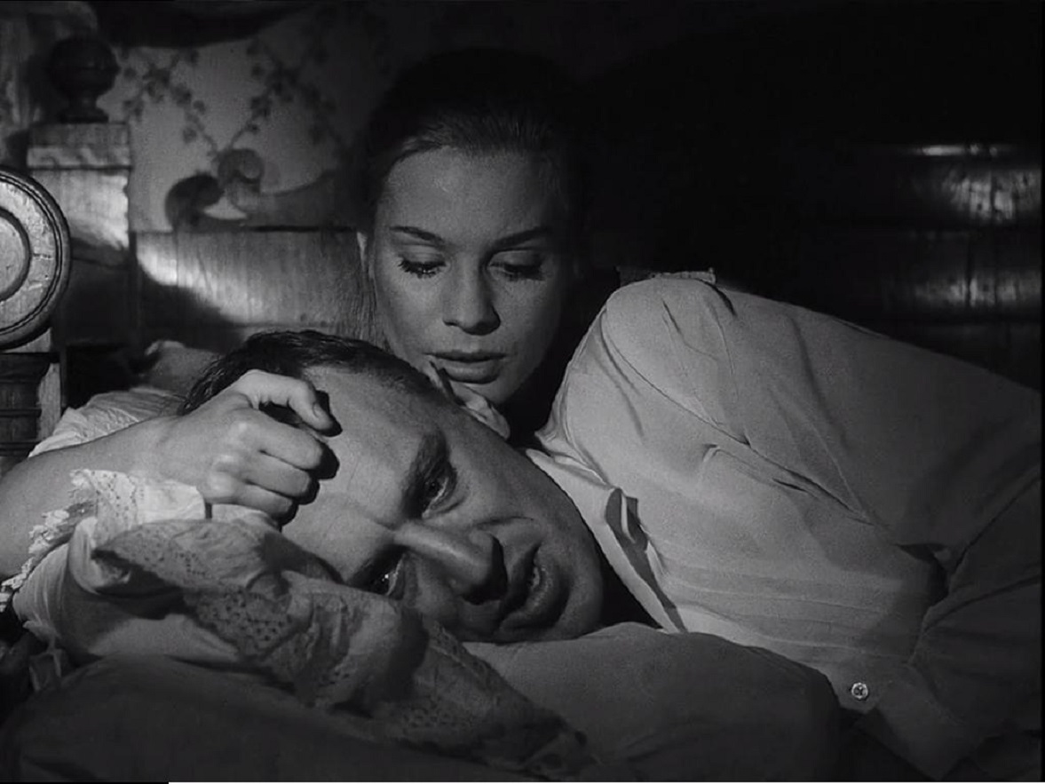 The sickly Vogler (Max Von Sydow) comforted by wife Ingrid Thulin in The Magician (1958)