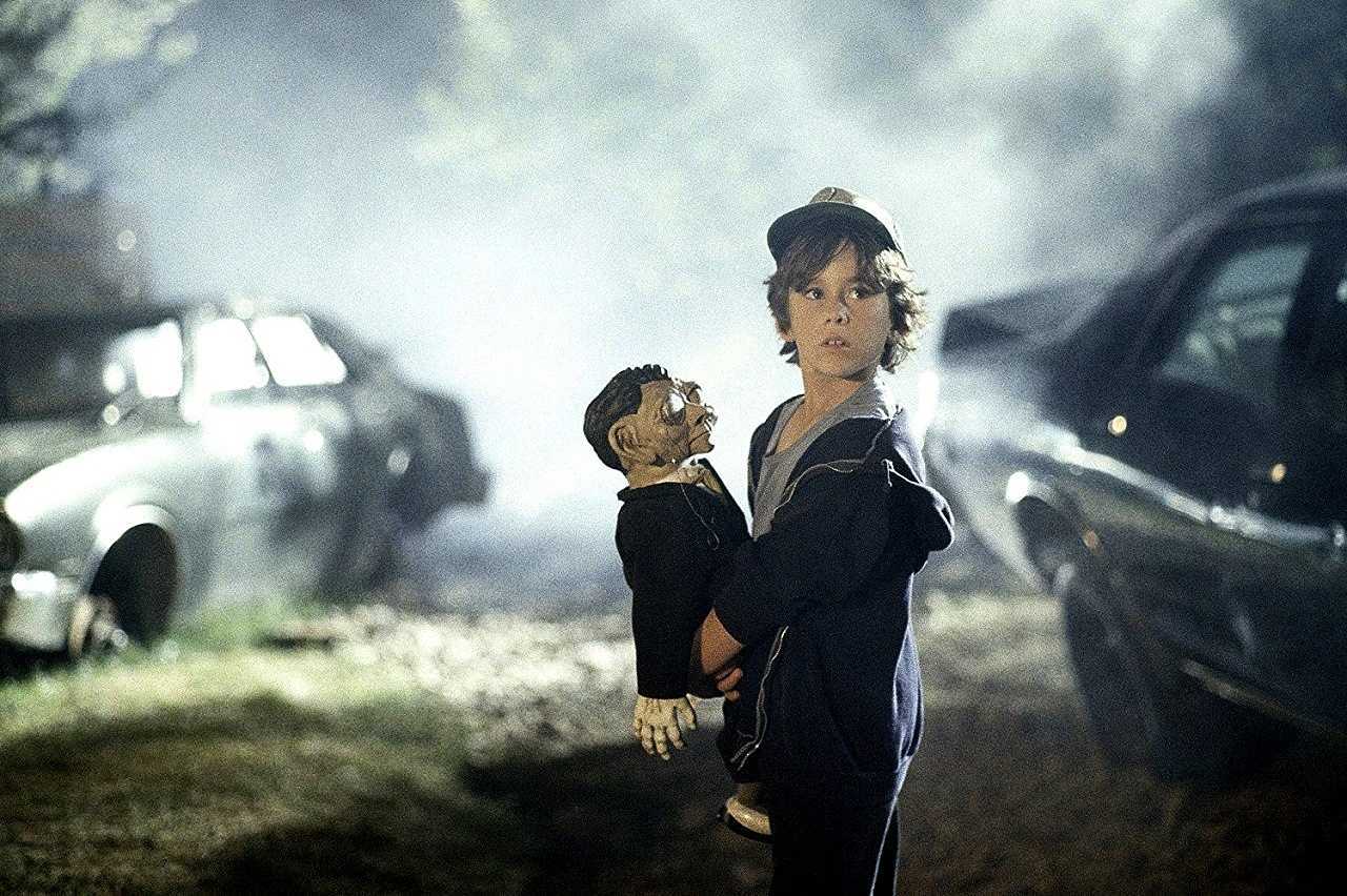 Joshua Morrell as Joey with sinister doll in Making Contact (1986)