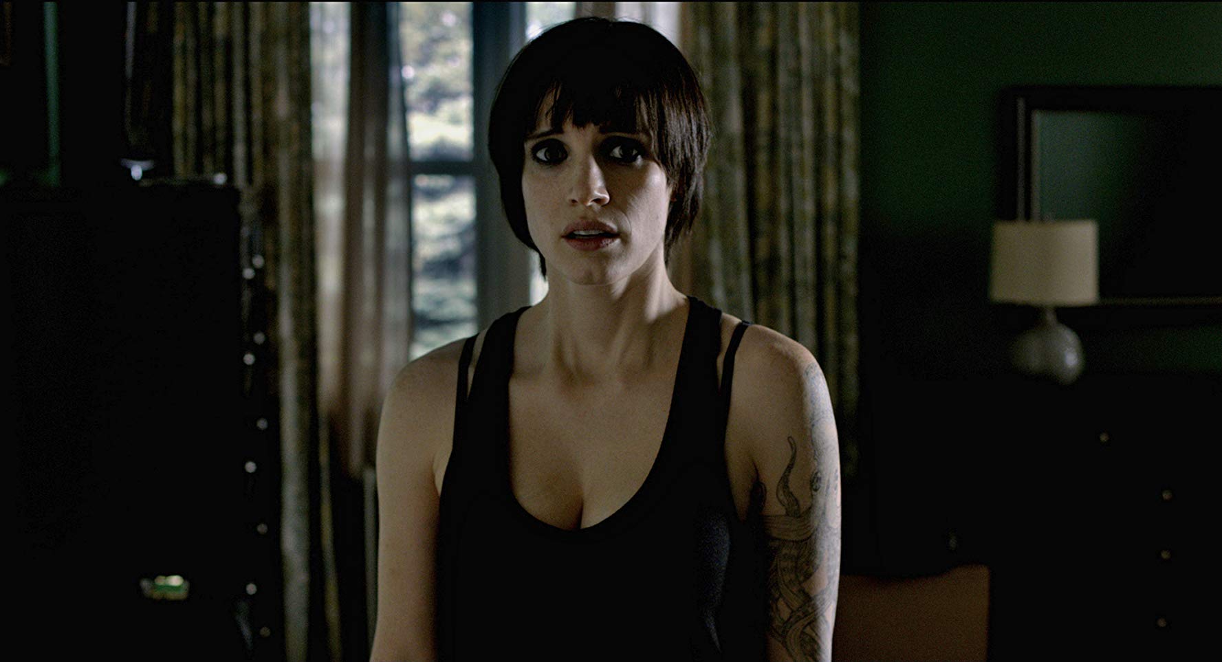 An unrecognisably black-haired and gothed-out Jessica Chastain in Mama (2013)