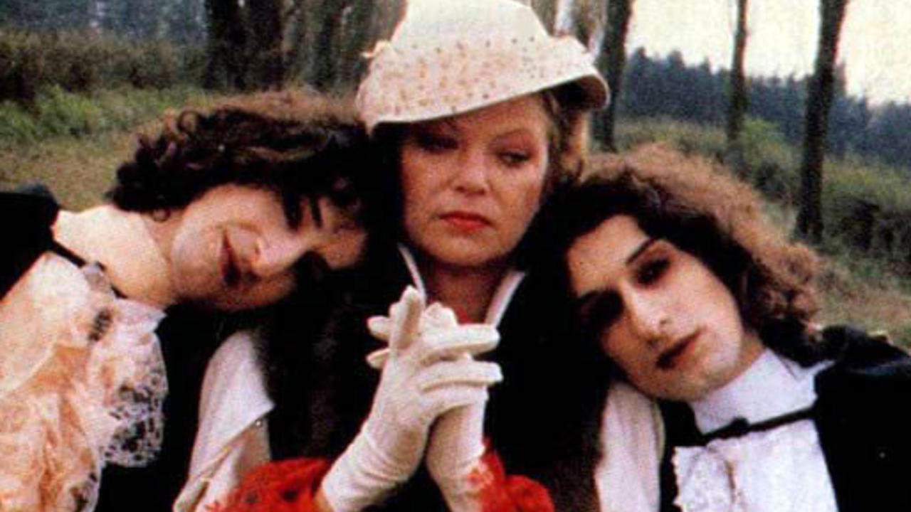 Countess Dracula (Louise Fletcher) flanked by sons Vladimir and Ladislas (twins Marc-Henri and Alexandre Wajnberg) in Mama Dracula (1980)