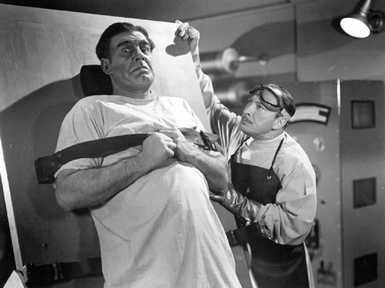 Lionel Atwill prepares to experiments on Lon Chaney Jr in Man-Made Monster (1941)