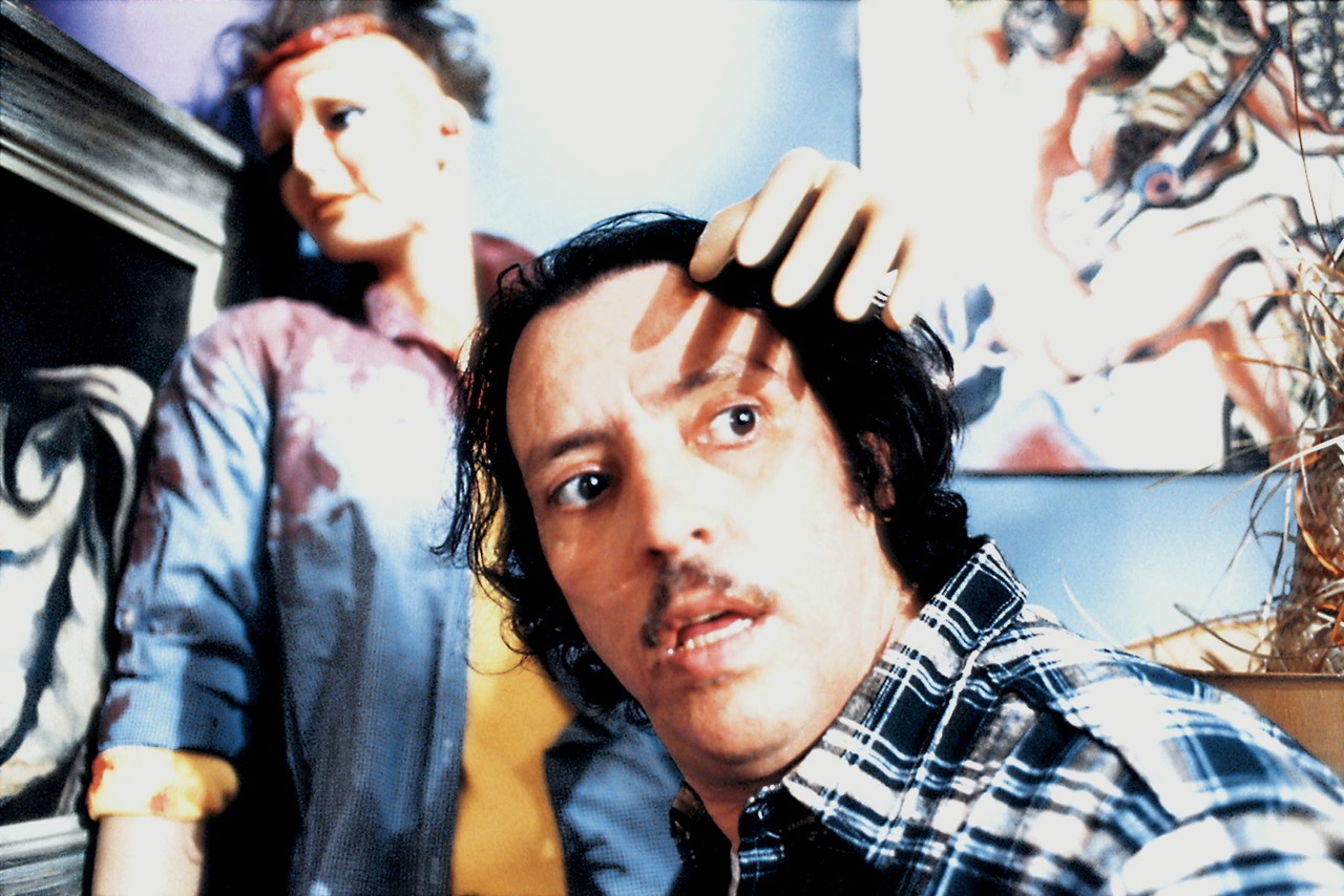 Joe Spinell as Frank Zito along with mannequins in Maniac (1980)