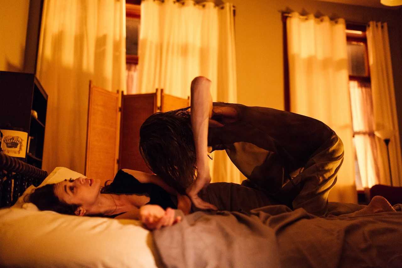 Mara (Javier Botet) appears to the sleeping Olga Kurylenko in Mara (2018)