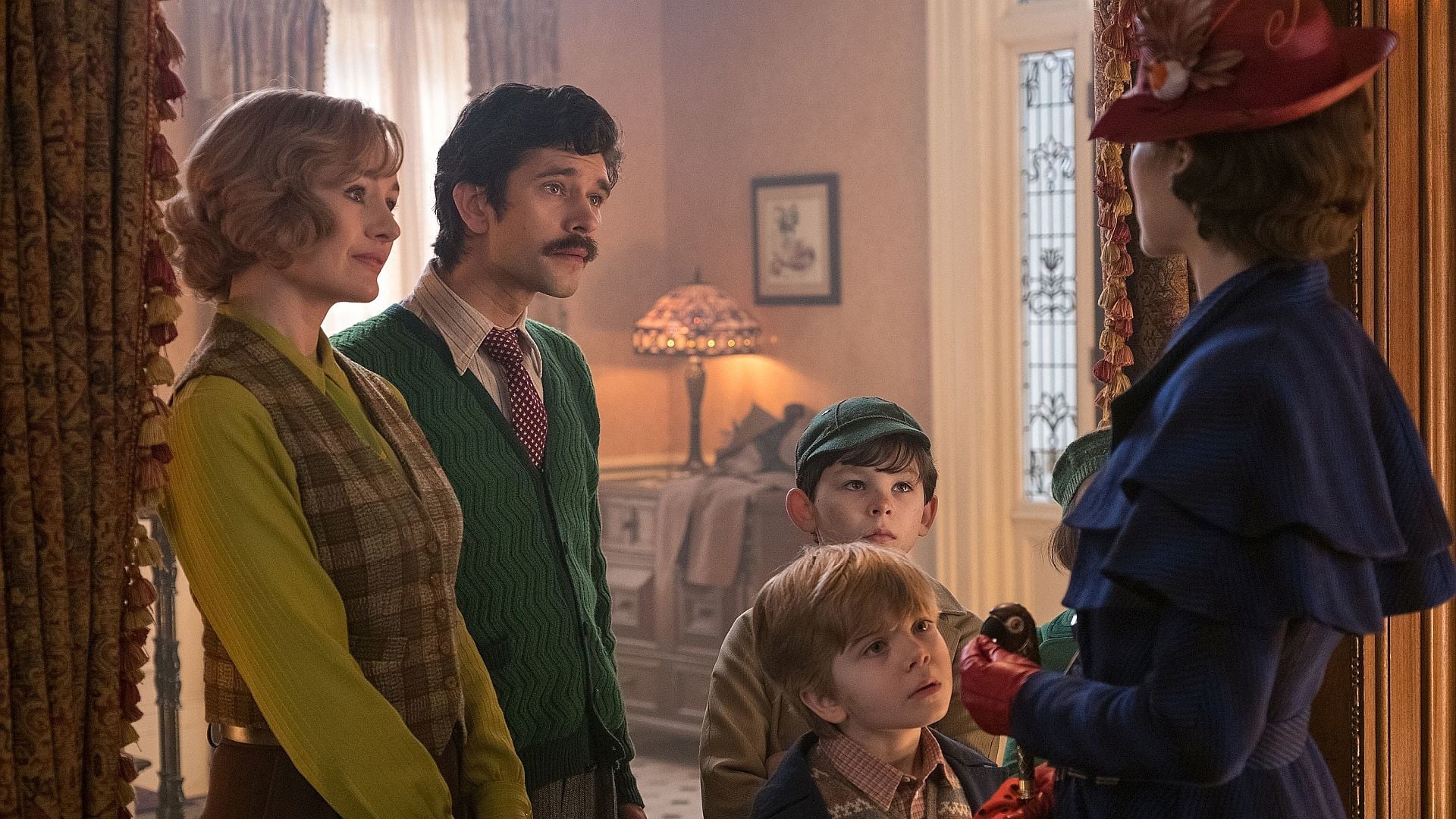 (l to r) The grown-up Banks children Jane (Emily Mortimer) and Michael (Ben Whishaw), his children Georgie (Joel Dawson) and John (Nathaniel Saleh), and Mary Poppins (Emily Blunt) in Mary Poppins Returns (2018)