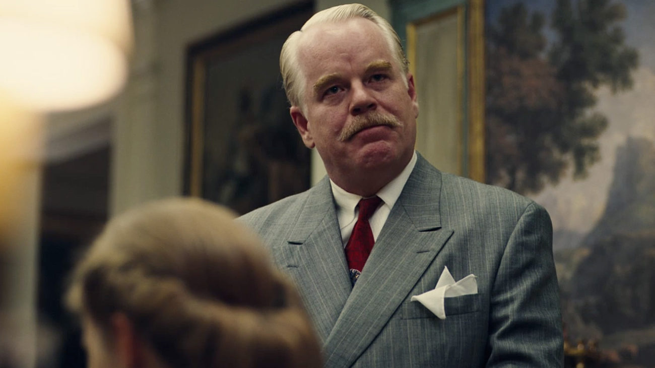 Philip Seymour Hoffman as Lancaster Dodd loosely based on L. Ron Hubbard in The Master (2012)