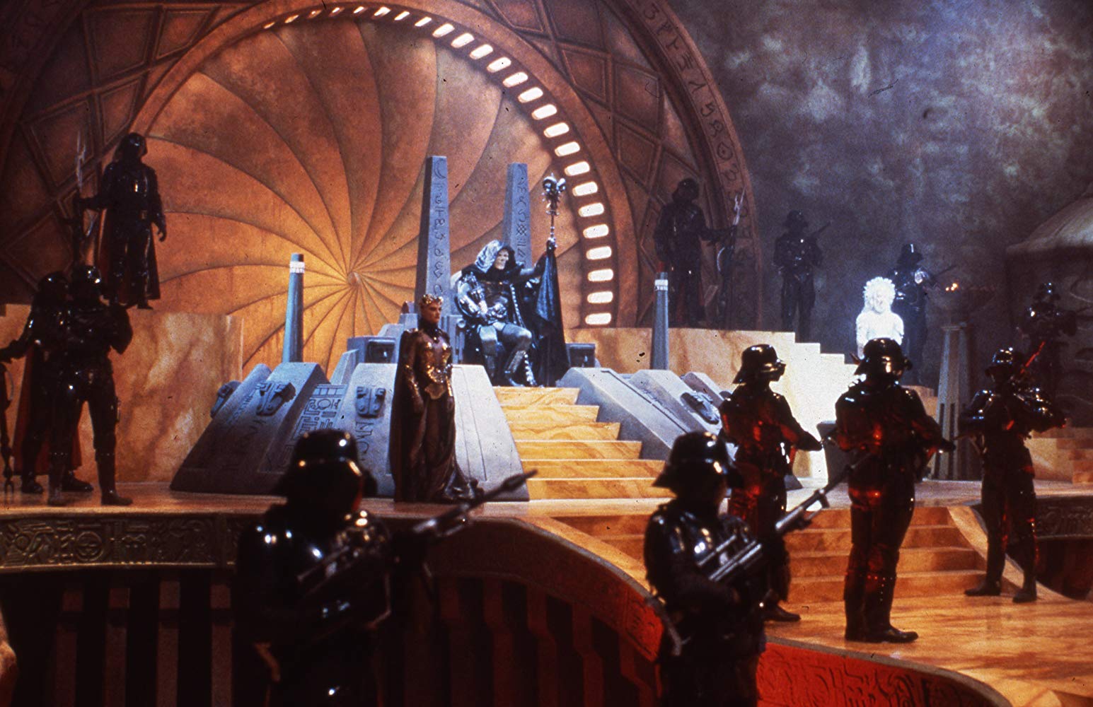 The superb sets for the film. Skeletor's throne room with Skeleteor (Frank Langella) seated and Evil-Lyn (Meg Foster) stand to his left in Masters of the Universe (1987)