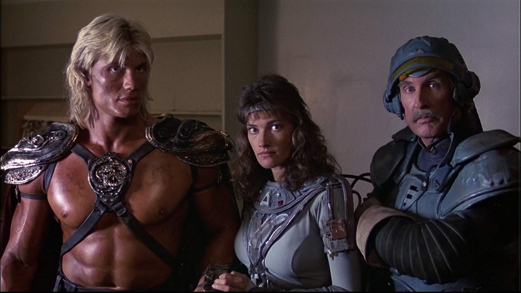 (l to r) He-Man (Dolph Lundgren), Teela (Chelsea Field) and Man-At-Arms (Jon Cypher) in Masters of the Universe (1987)