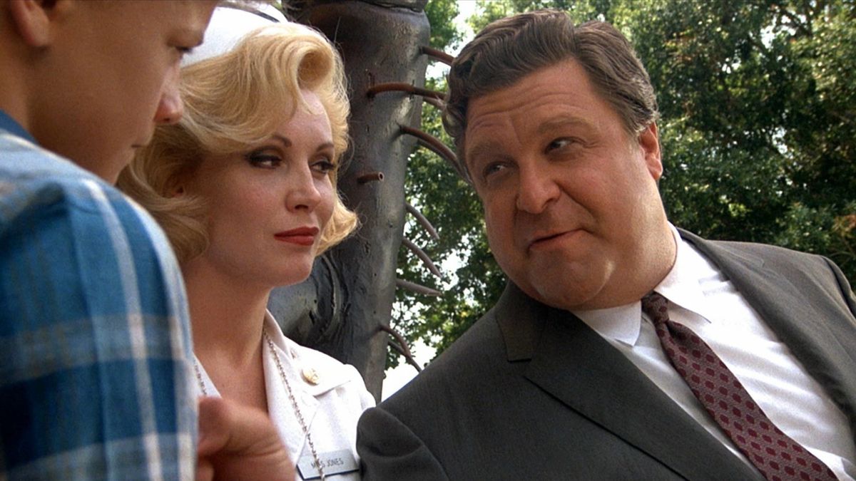 (l to r) Young Simon Fenton, actress Cathy Moriarty and John Goodman as Lawrence Woolsey, the film's homage to William Castle in Matinee (1993)