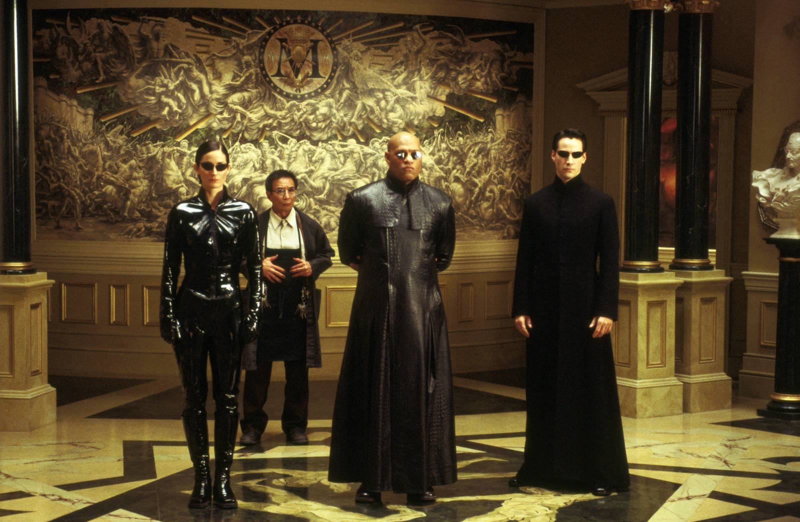 Character ine-up - (l to r) Trinity (Carrie-Anne Moss), The Keymaker (Randall Duk Kim), Morpheus (Laurence Fishburne) and Neo (Keanu Reeves) in The Matrix Reloaded (2003)