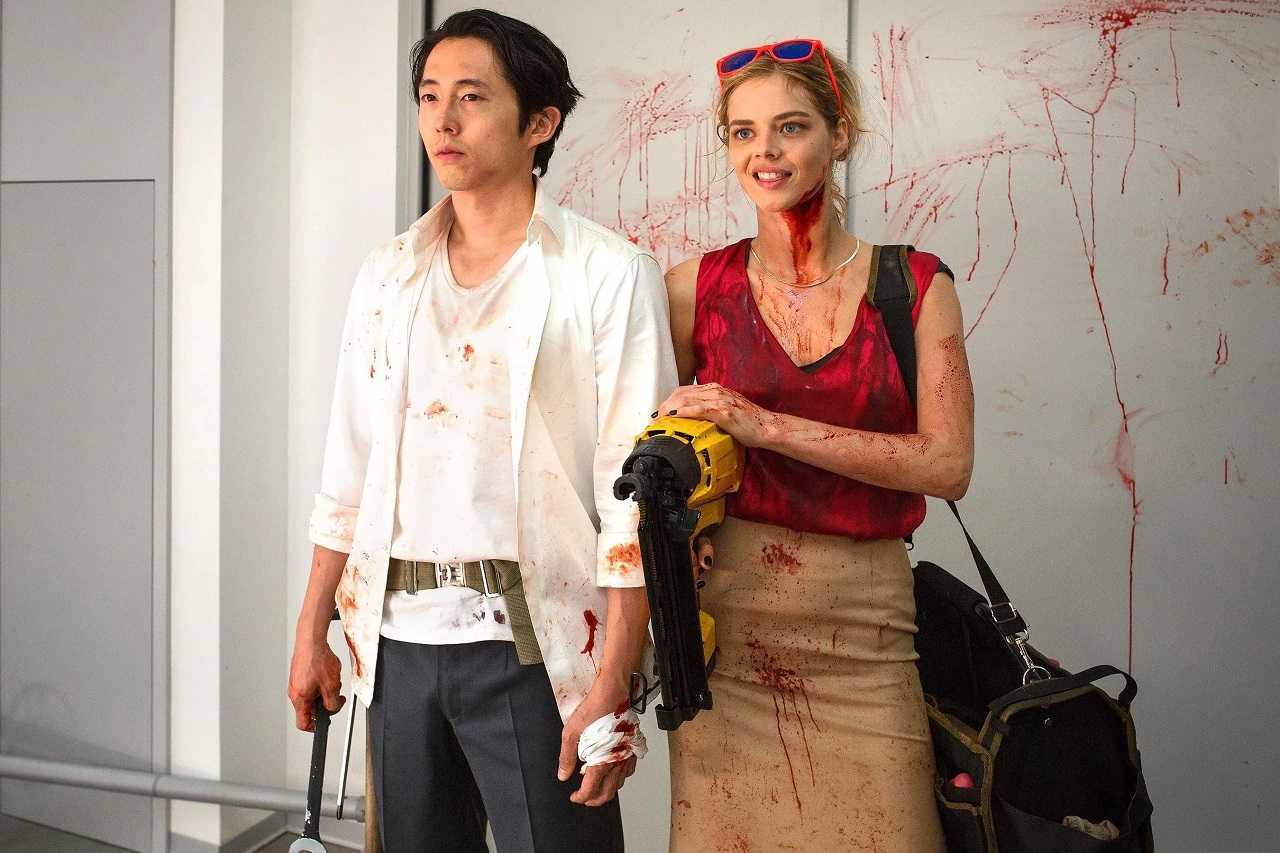 Steven Yuen and Samara Weaving face mass insanity in an office in Mayhem (2017)