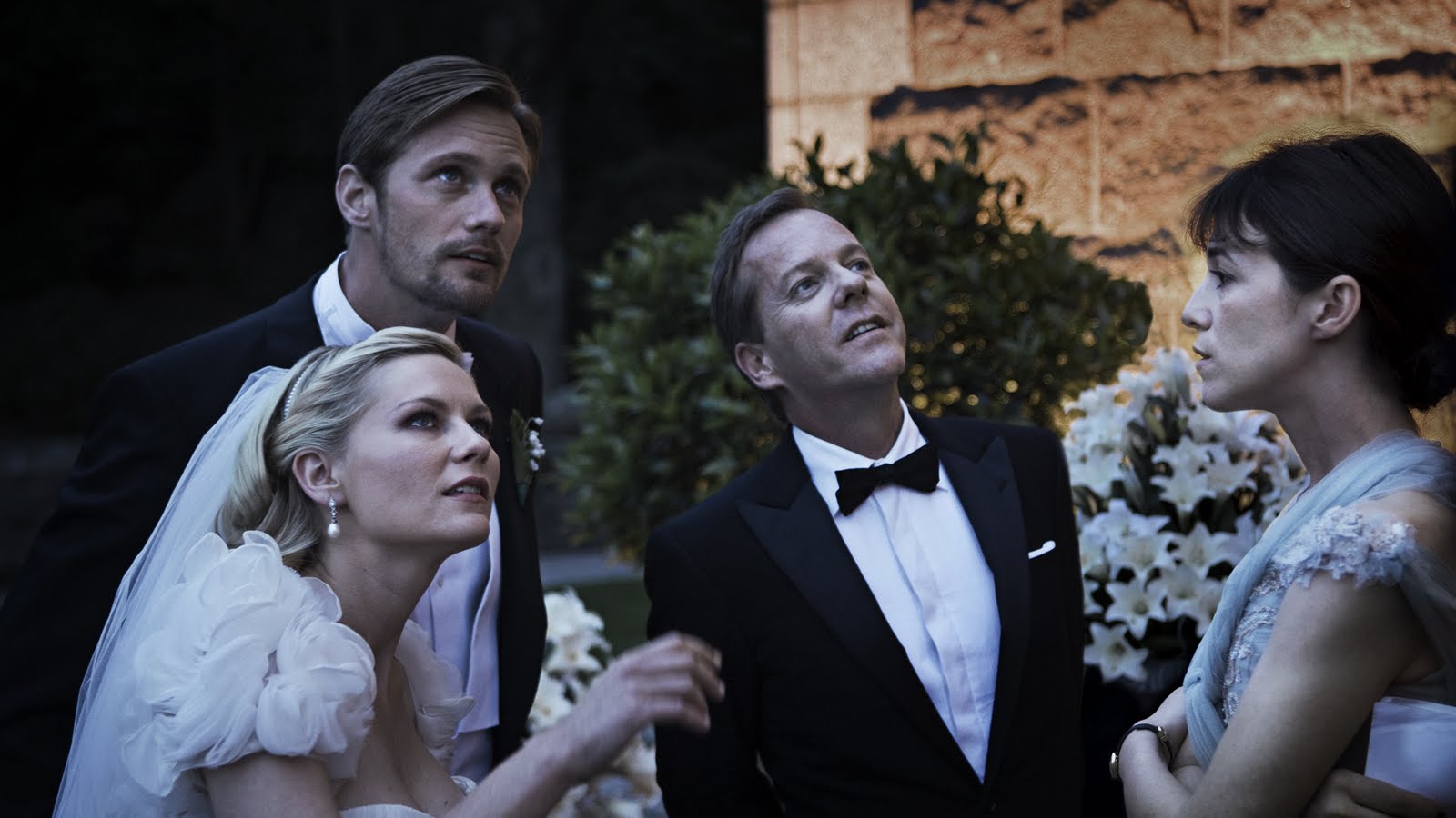 Alexander Skarsgard, Kirsten Dunst, Kiefer Sutherland, Charlotte Gainsbourg in Melancholia (2011)