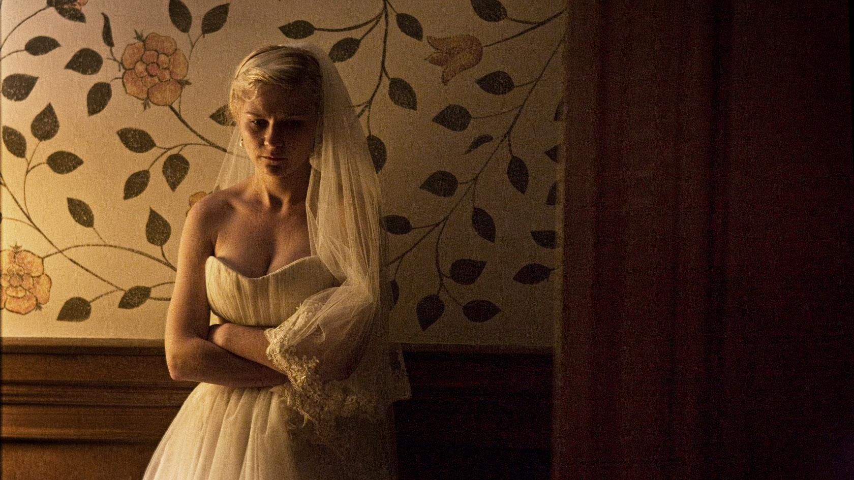 Kirsten Dunst falls into deep depression on her wedding day in Melancholia (2011)