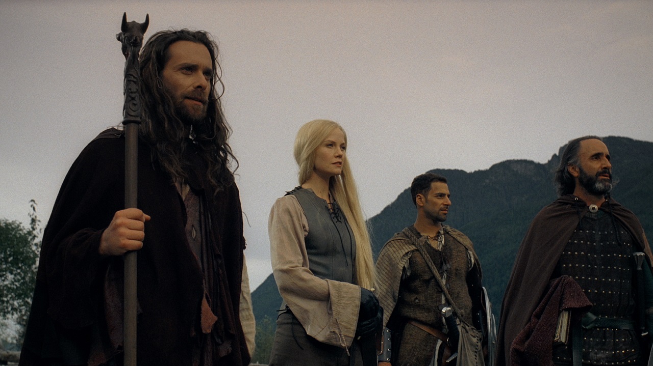 Merlin (James Callis), King Arthur's daughter Avlynn (Laura Harris), Tristan (Patrick Sabongui) and Sir Galahad (Donald Adams) in Merlin and the Book of Beasts (2008)