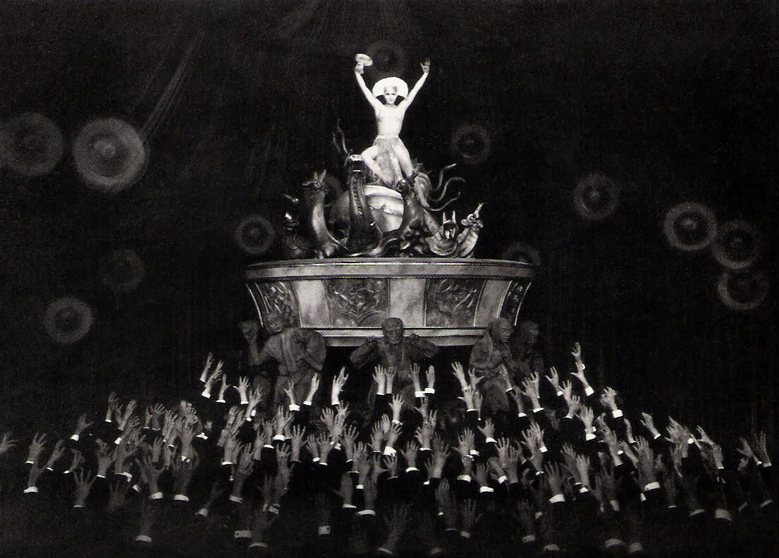 The android Maria (Brigitte Helm) stirs the worker's with an erotic dance in Metropolis (1927)