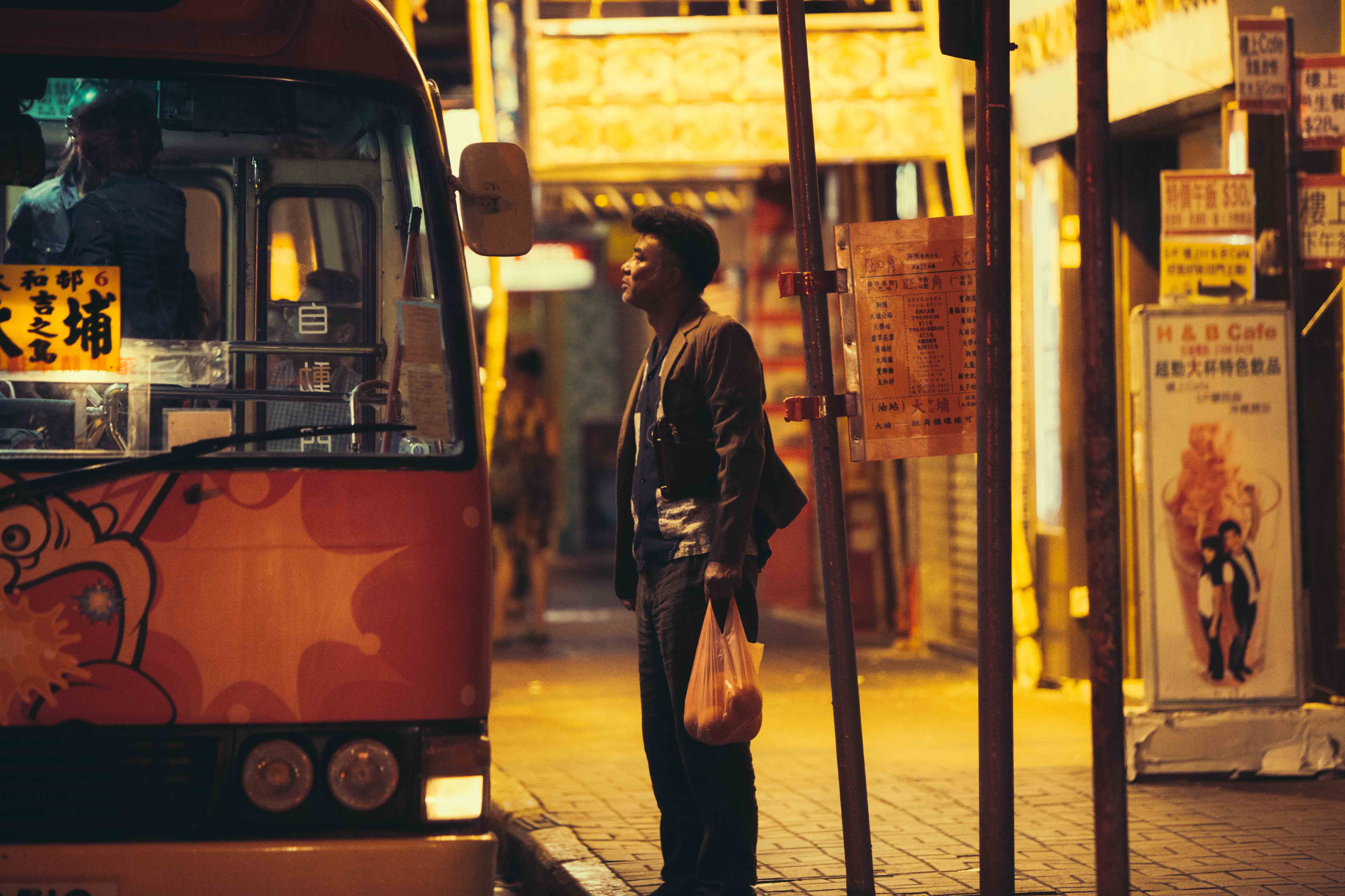 Boarding the bus to Tai Po Road in The Midnight After (2014)