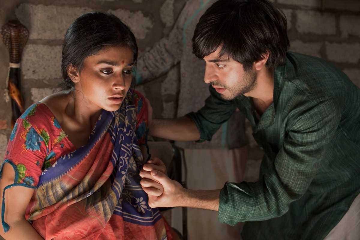 Satya Babha as Saleem Sinai, the poor child swapped at birth, with his love Parvati (Shriya Saran) in Midnight's Children (2012)