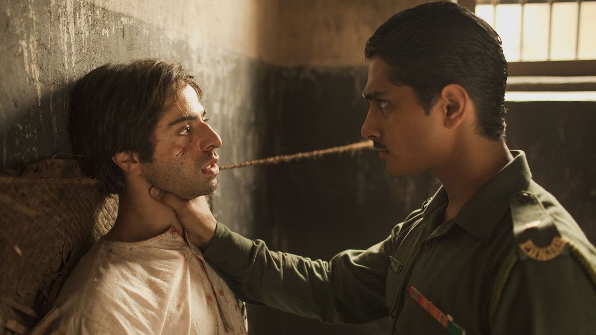 (l to r) Saleem Sinai (Satya Babha) threatened by Shiva (Siddharth), the child he was swapped at birth with grown up as a harsh military officer in Midnight's Children (2012)