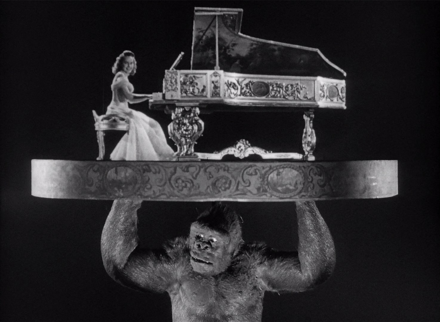 Joe lifts Terry Moore above his head as she plays Beautiful Dreamer in Mighty Joe Young (1949)