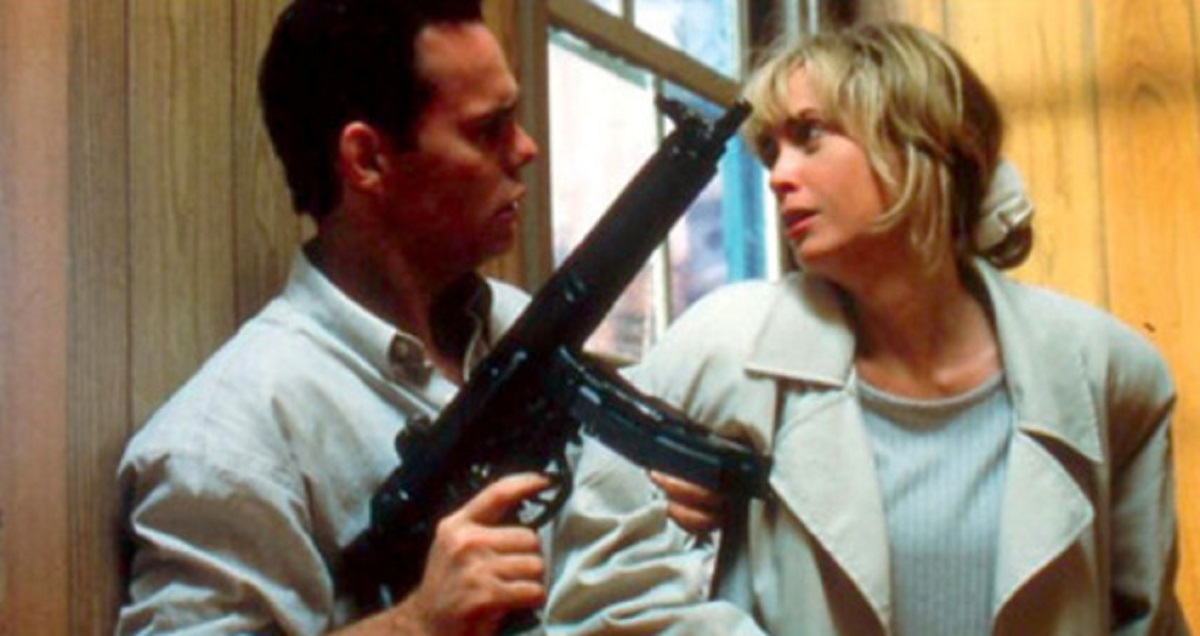 Sperm donor Kevin Dillon holds recipient mother Lysette Anthony at gunpoint in Misbegotten (1997)