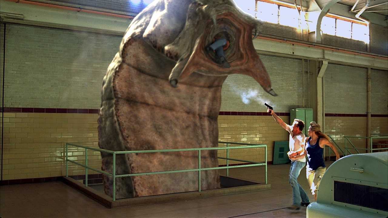 Sean Patrick Flanery and Victoria Pratt fight off the Mongolian Death Worm (2010)