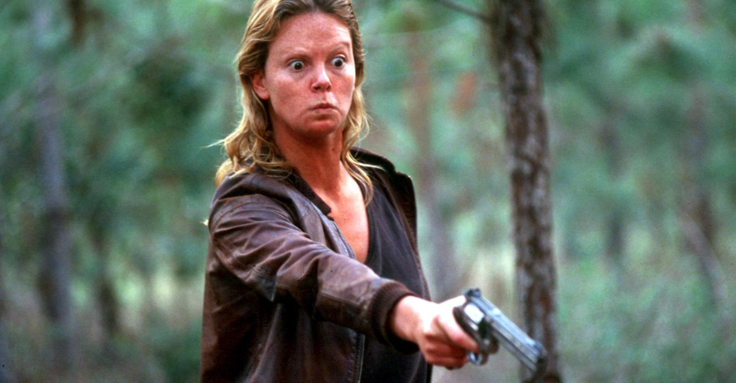  Aileen (Charlize Theron) wields gun against one of her victims in Monster (2003)