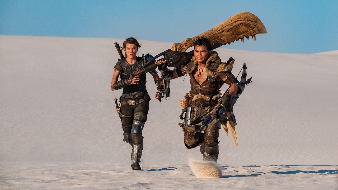 Artemis (Milla Jovavich) and Hunter (Tony Jaa) wielding The Great Sword in Monster Hunter (2020)