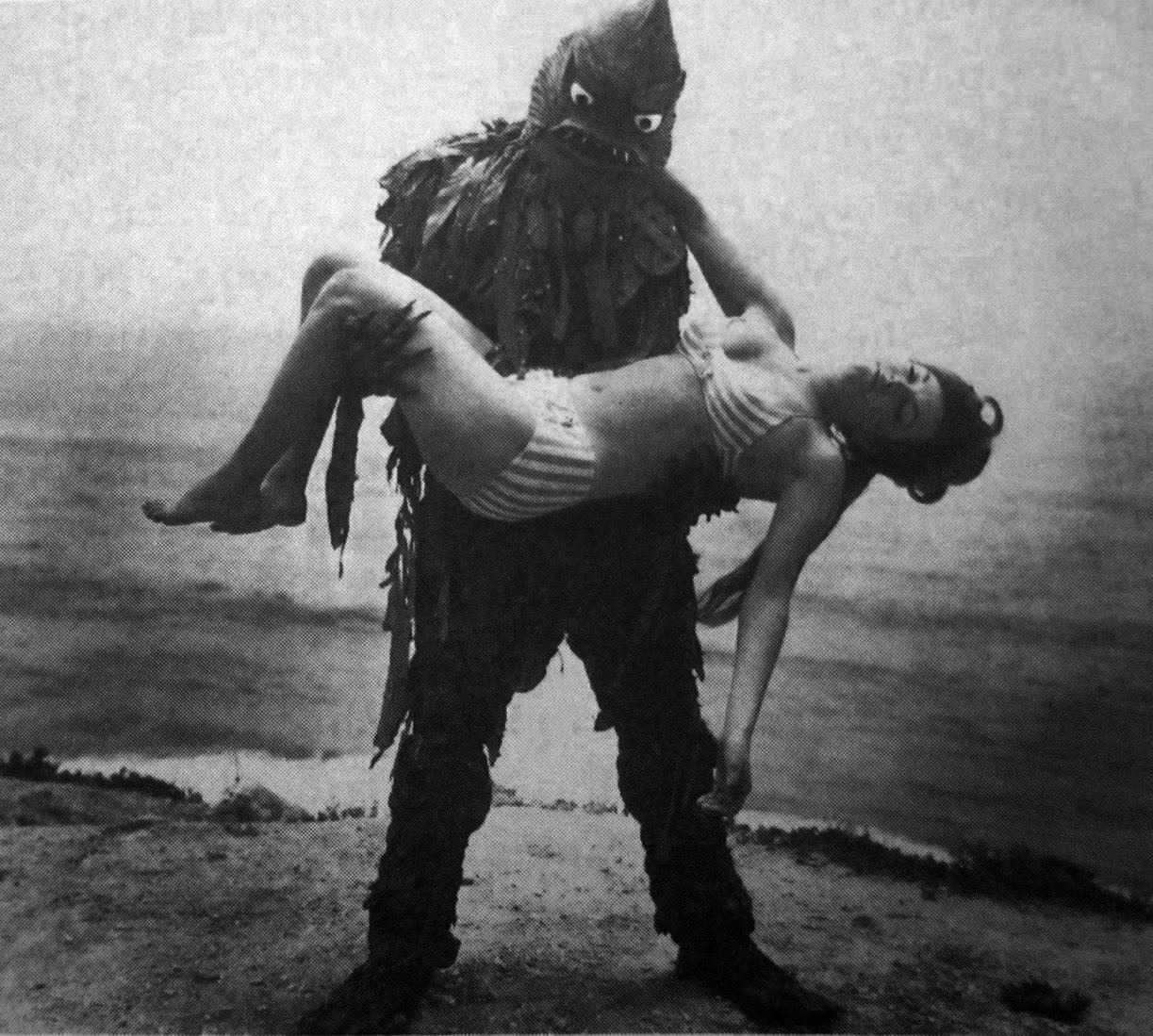 The monster carries a girl away in Monster from the Surf (1965)