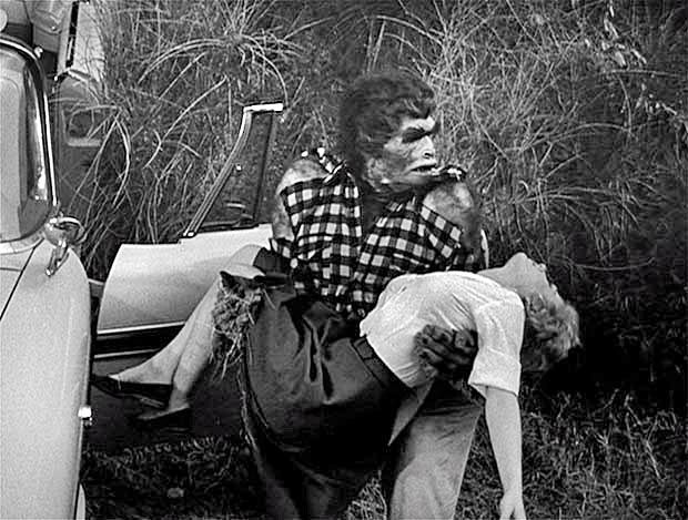 A prehistorically transformed Arthur Franz abducts Joanna Moore in Monster on the Campus (1958)