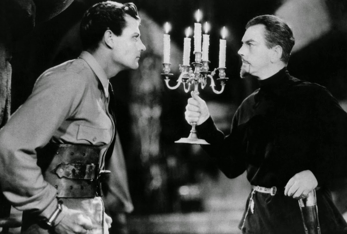 Shipwreck survivor Joel McCrea confronts Count Zaroff (Leslie Banks) in The Most Dangerous Game (1932)