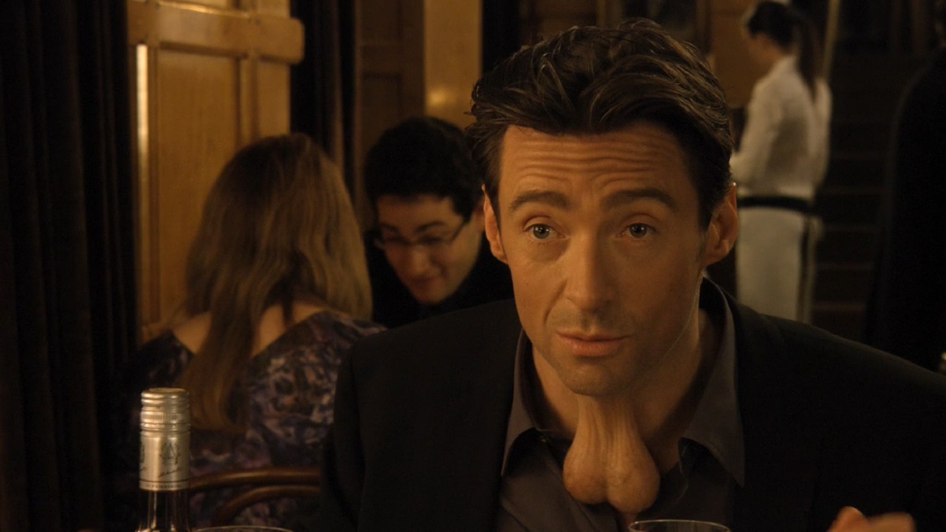 Hugh Jackman with a pair of testicles on his neck in Movie 43 (2013). 