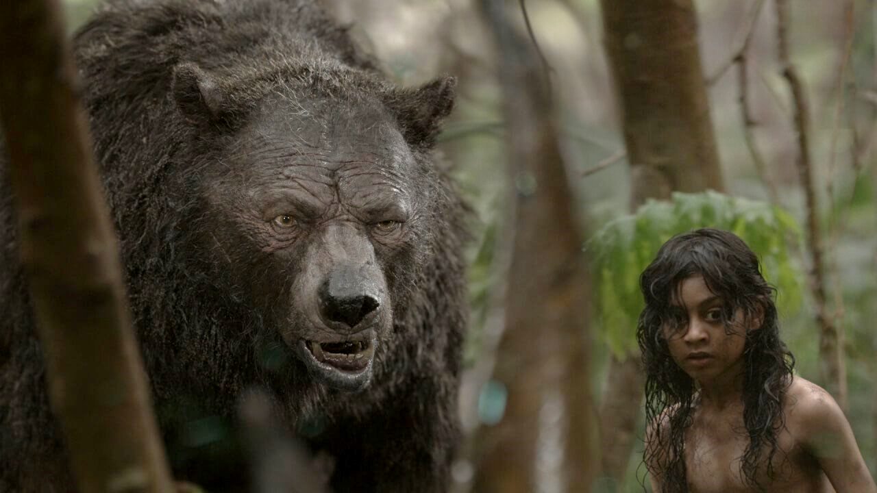 (l to r) Baloo (a mocapped Andy Serkis, also the film's director) and Mowgli (Rohan Chand) in Mowgli (2018)