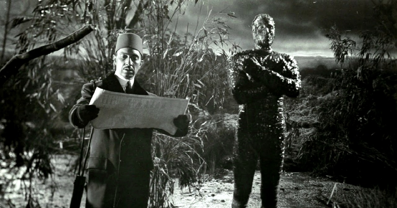 Mehemet Bey (George Patsell) raises Kharis (Christopher Lee) from the swamp in The Mummy (1959)