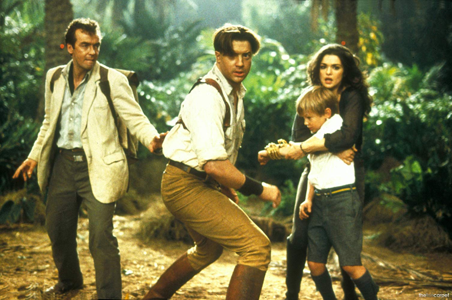 Back in action - Jonathan Carnahan (John Hannah), Rick Carter (Brendan Fraser), Evelyn (Rachel Weisz) who is now his wife and their son Alex (Freddie Boath) in The Mummy Returns (2001)