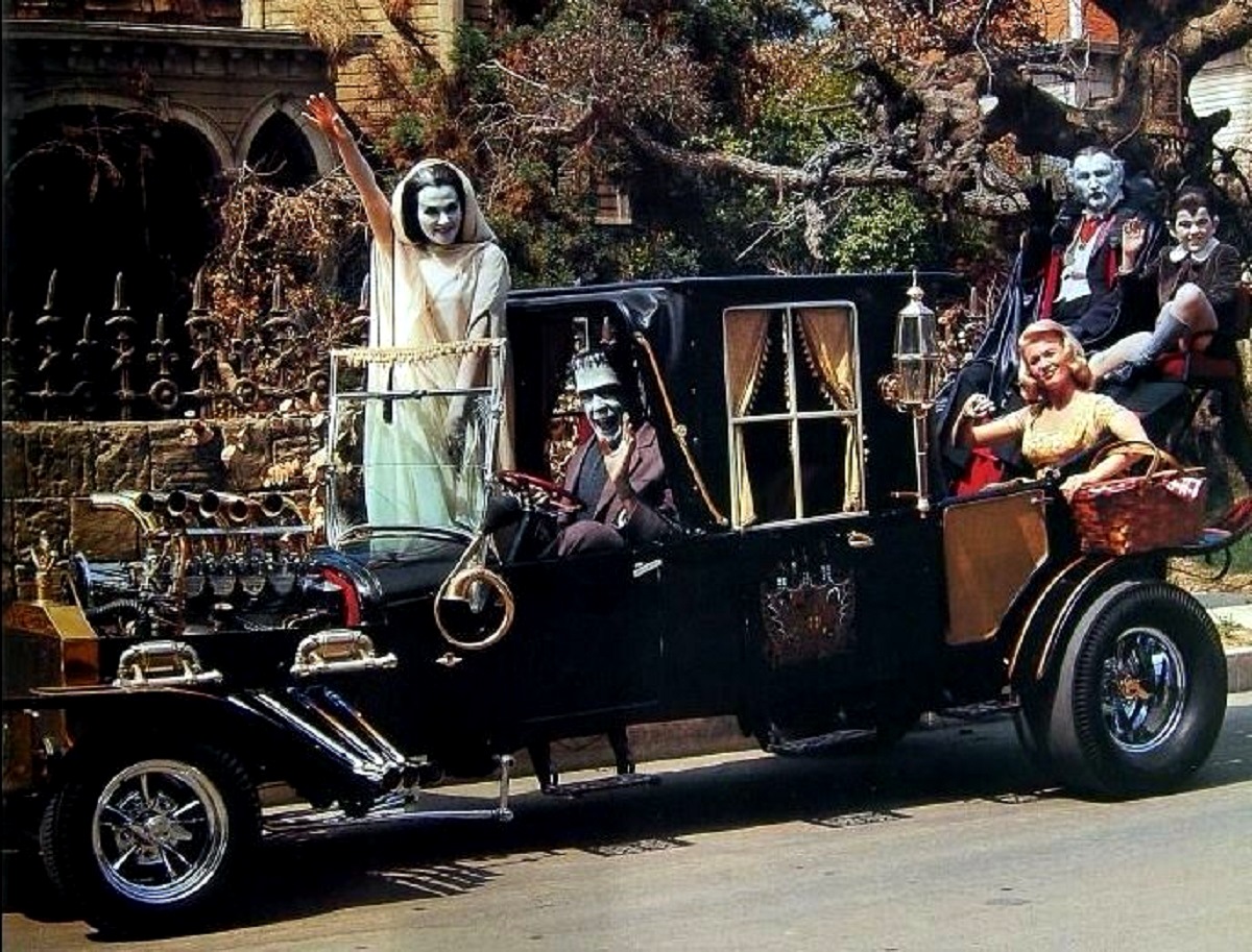 Lily (Yvonne de Carlo), Herman (Fred Gwynne), Marilyn (Debbie Watson), Grandpa (Al Lewis), and Eddie (Butch Patrick) in the Munster Koach in Munster Go Home (1966)