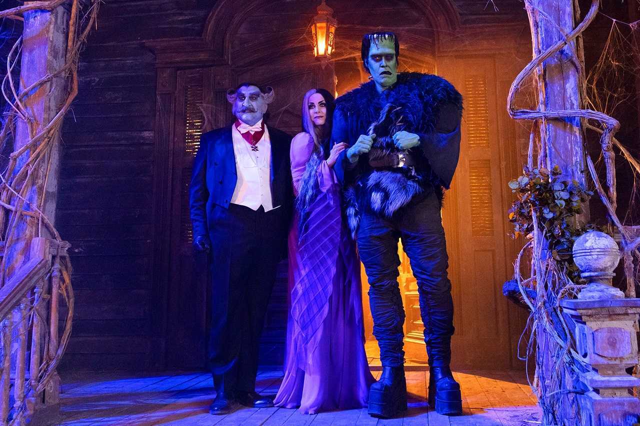The Count (Daniel Roebuck), Lily (Sheri Moon Zombie) and Herman (Jeff Daniel Phillips) in The Munsters (2022)