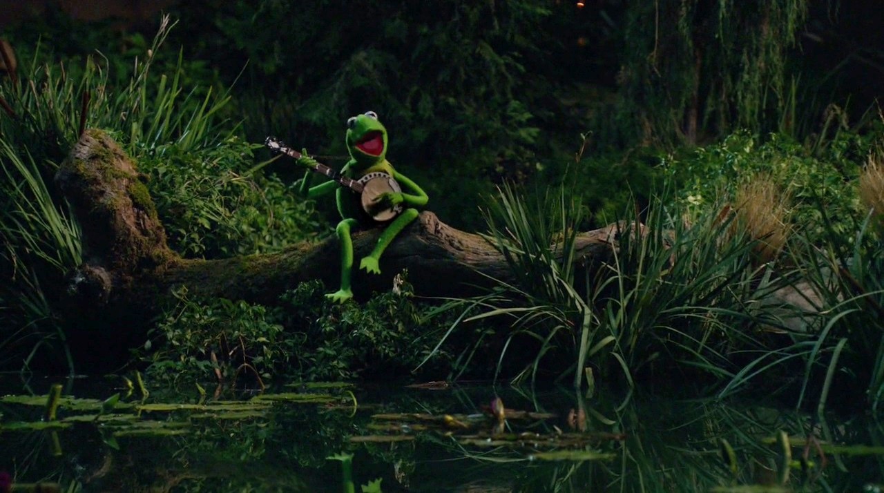 Kermit the Frog plays banjo in the swamp in The Muppet Movie (1979)