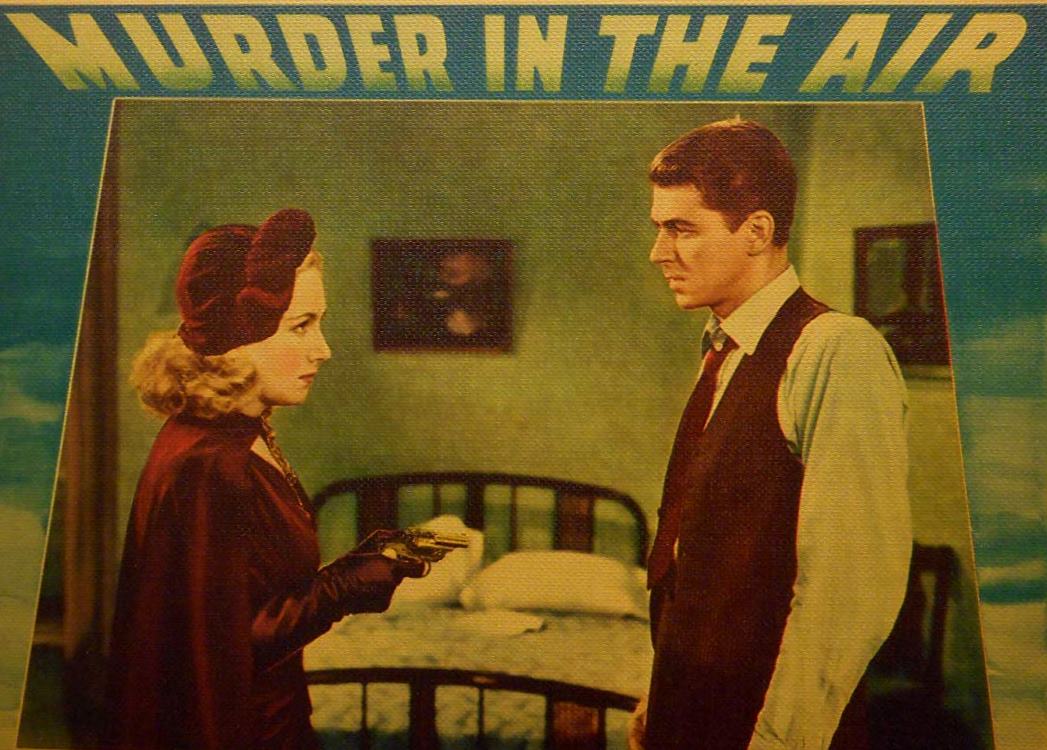 Ronald Reagan as Treasury agent Brass Bancroft along with Lya Lys in Murder in the Air (1940)