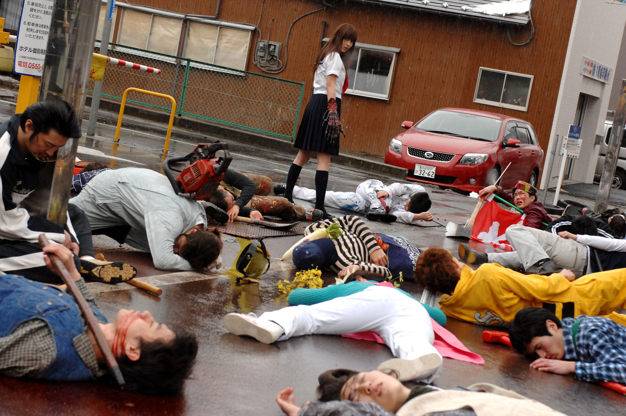 Yumi Sugimoto slaughters an entire street with her claw in Mutant Girls Squad (2010)