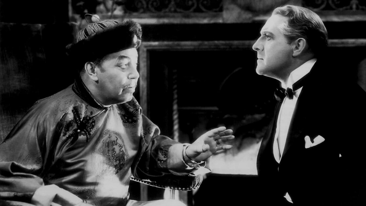 Fu Manchu (Warner Oland) and Inspector Nayland Smith (O.P. Heggie) in The Mysterious Dr, Fu Manchu (1929)