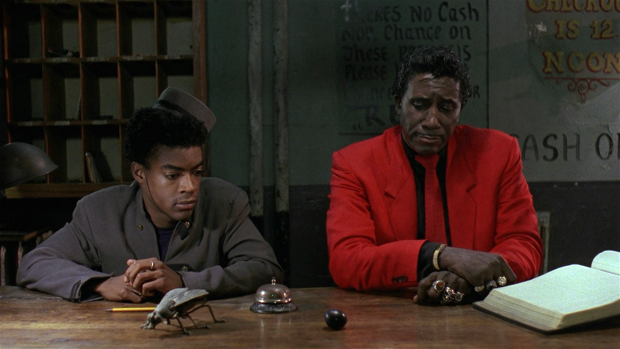 The hotel's night porters (l to r) Cinque Lee (brother of Spike) and Screamin’ Jay Hawkins in Mystery Train (1989)