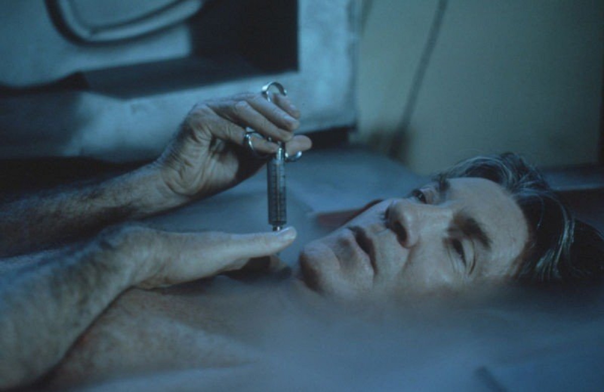 David Warner injects himself in The Cold episode of Necronomicon (1993)