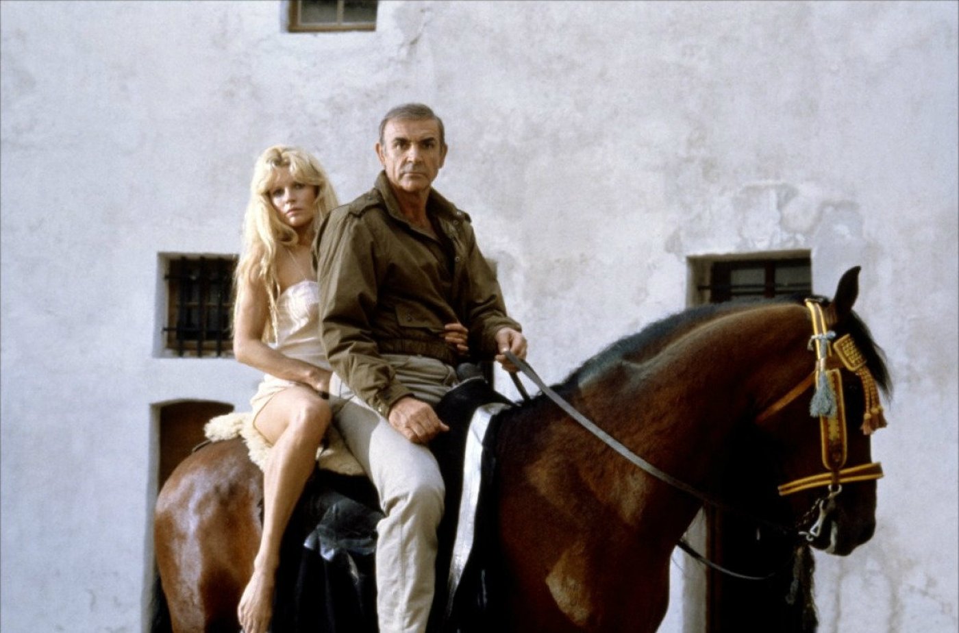 James Bond (Sean Connery) and Domino (Kim Basinger) escape on horseback in Never Say Never Again (1983)