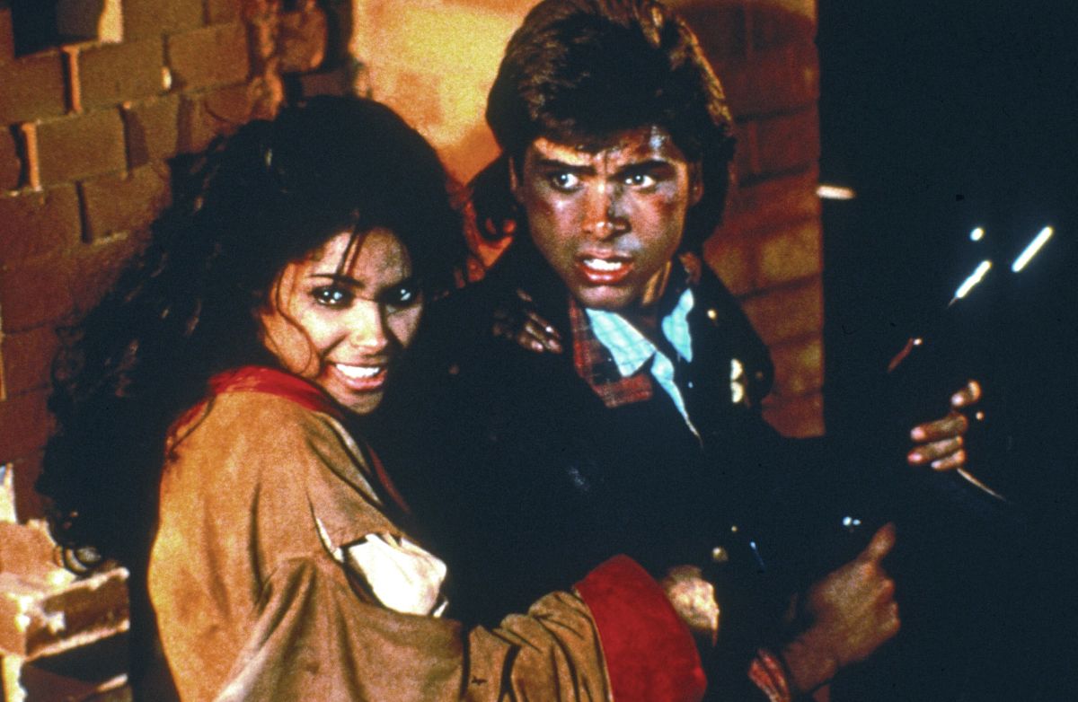 John Stamos and Vanity in Never Too Young to Die (1986)