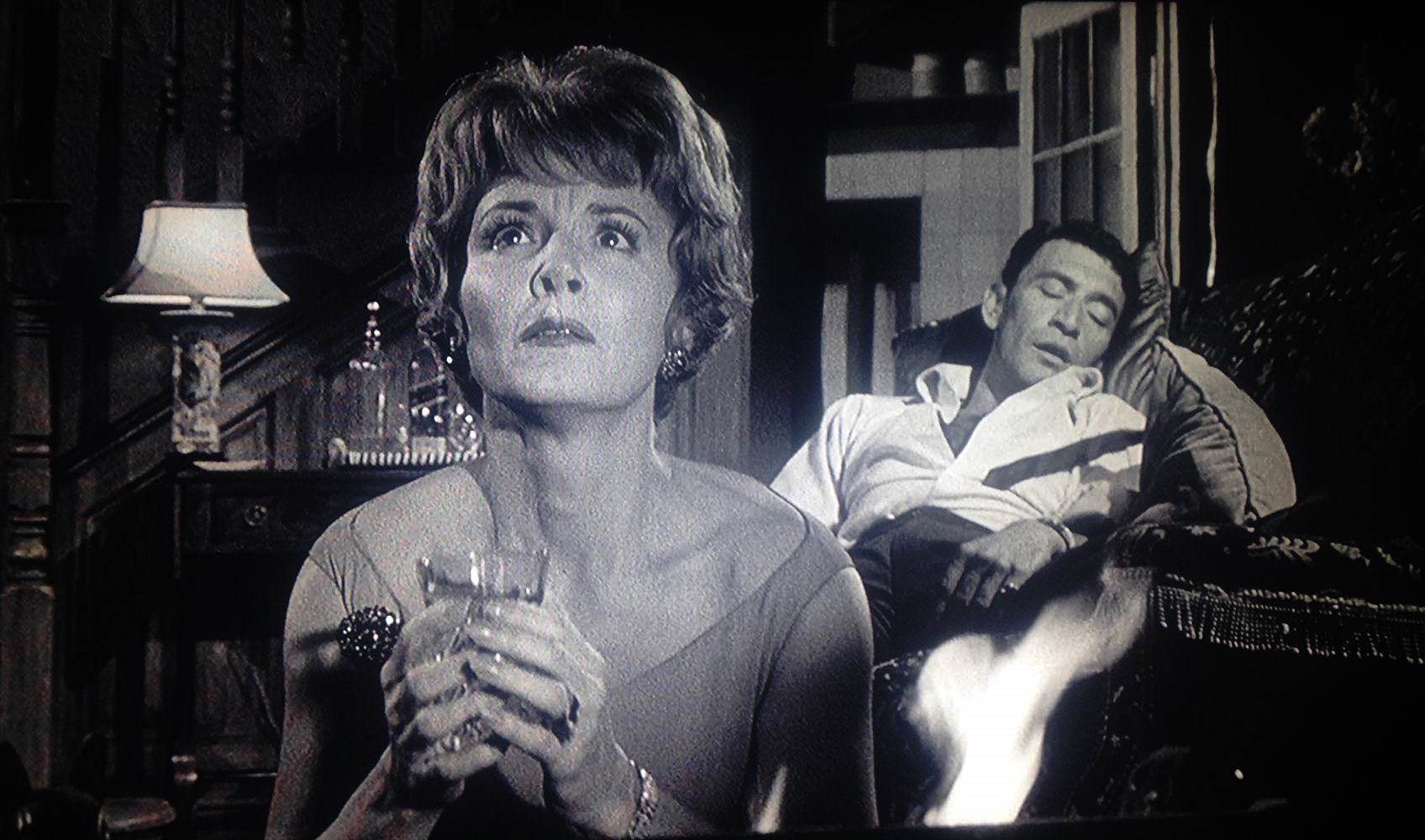 Wife Janet Blair is fearful of magical malice while husband Peter Wyngarde naps in Night of the Eagle (1961)