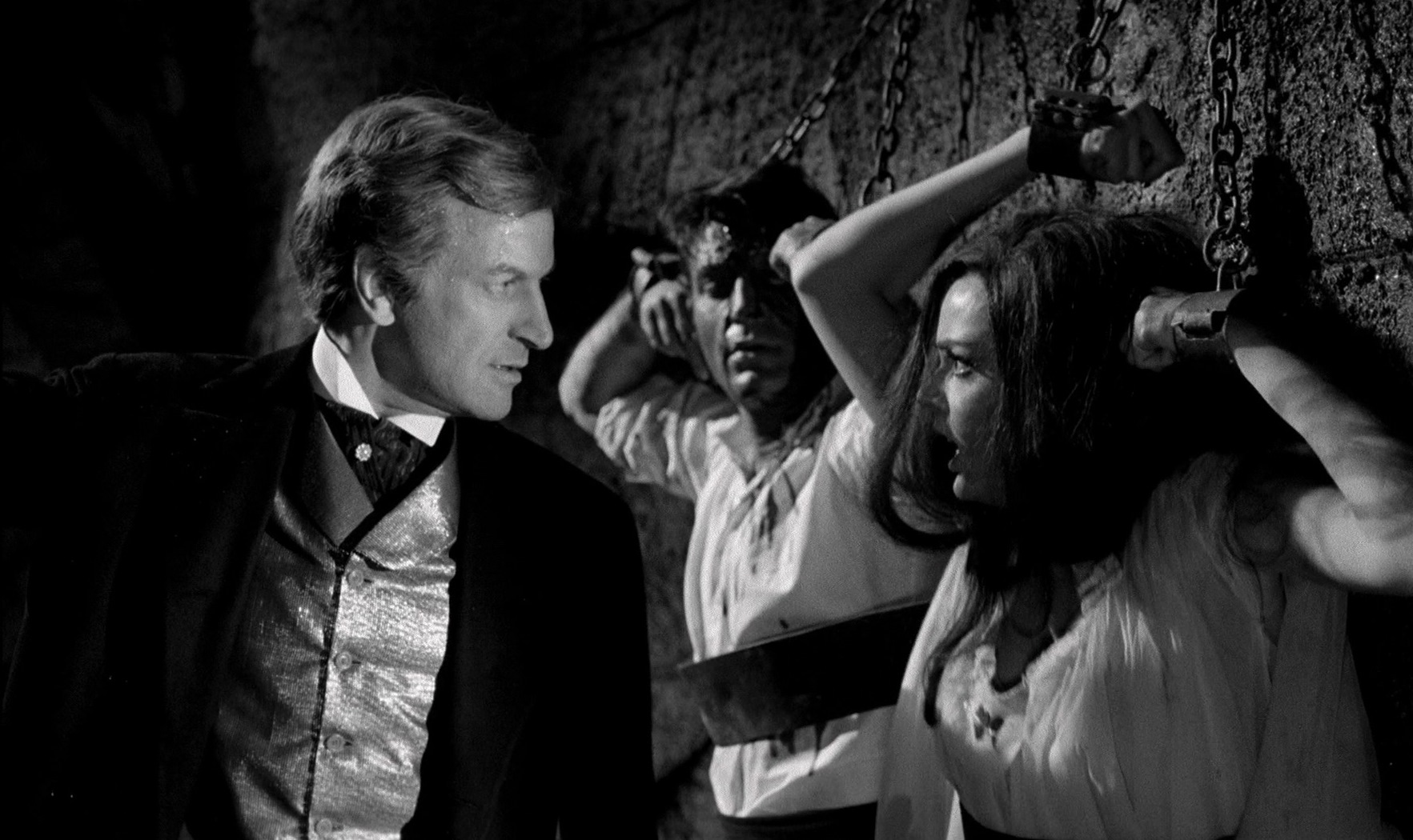 Paul Muller chains Barbara Steele and her lover Rik Battaglia up in the dungeon in Nightmare Castle (1965)