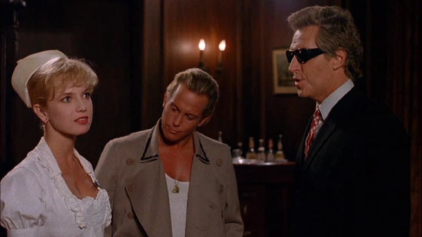 (l to r) Nurse Traci Lords, chauffeur Lenny Juliano and the mysterious Mr Johnson (Arthur Roberts) in Not Of This Earth (1988)